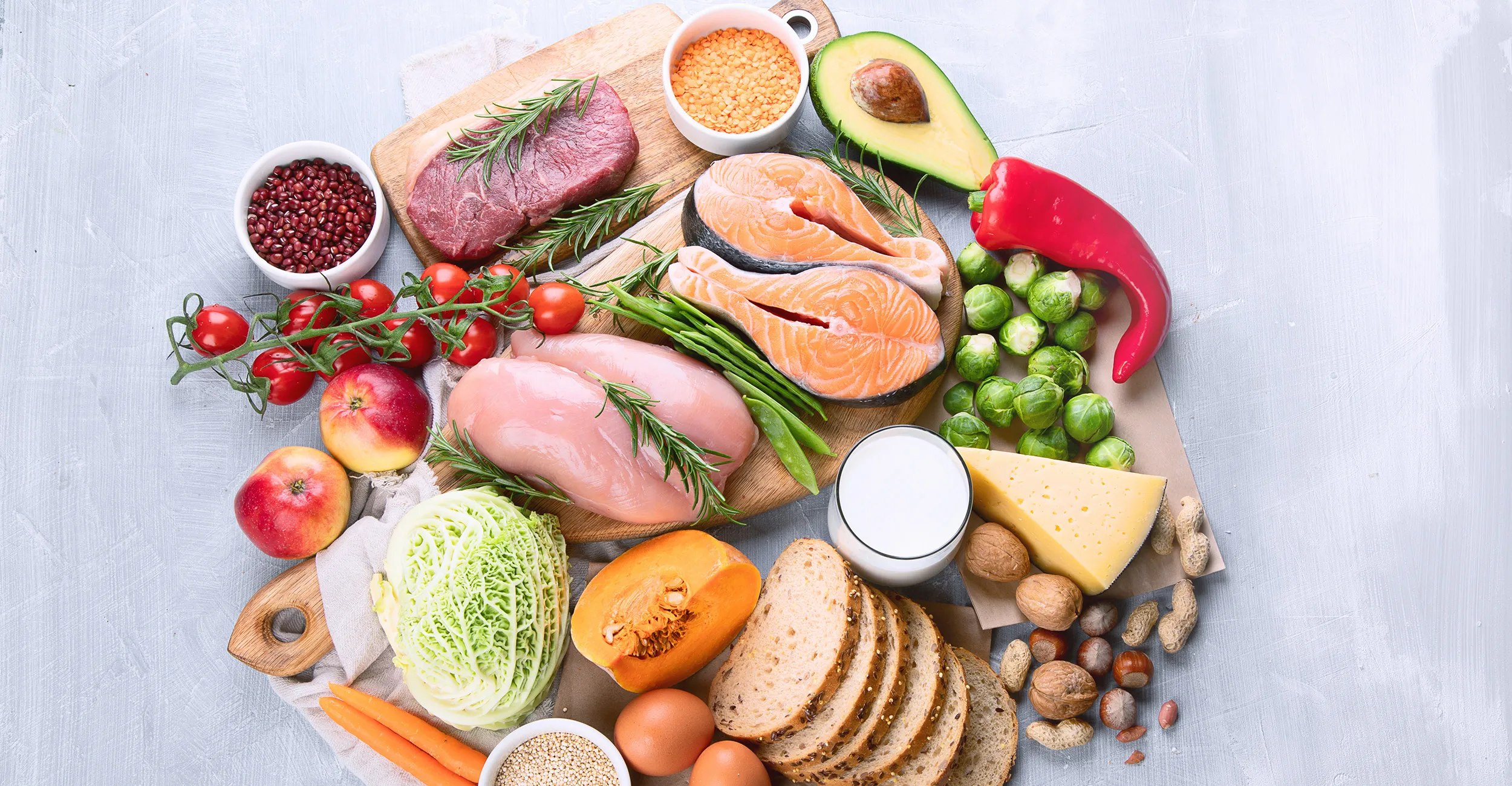 Balanced plate illustration with colorful whole foods and fresh vegetables